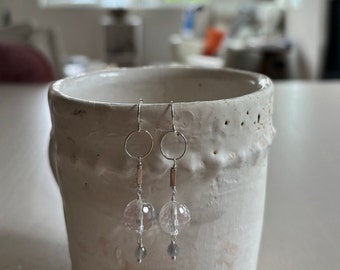 silver and clear long earrings