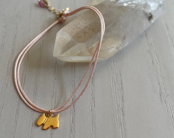 delicate dog charm cord bracelet / gold