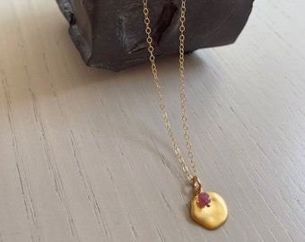gold disc pendant with pink tourmaline