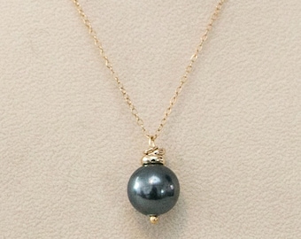 black pearl pendant with gold rings