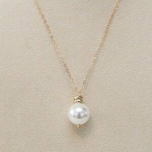 pearl pendant with gold rings