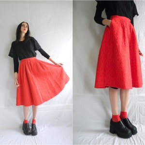 50s red quilted flared cotton skirt with black and gold abstract print.