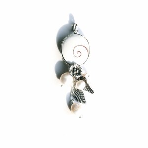 Beautiful Natural Shiva Eye Shell Seascape Pendant with Fresh Water Pearl Bead and Silver Charm in sterling silver setting.