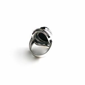Absolutely stunning black onyx cocktail ring in sterling silver setting. Multi Faceted Oval Cut Onyx gemstone. image 5