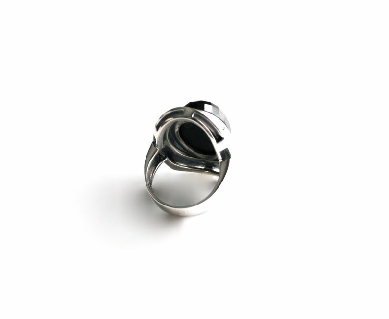 Absolutely stunning black onyx cocktail ring in sterling silver setting. Multi Faceted Oval Cut Onyx gemstone. image 5