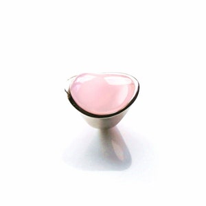 Beautiful pink, rose quartz cocktail ring in sterling silver. Modern, unique and high fashion ring.