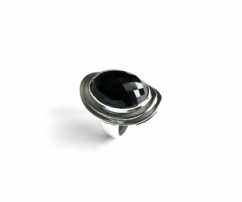 Absolutely stunning black onyx cocktail ring in sterling silver setting. Multi Faceted Oval Cut Onyx gemstone. image 2