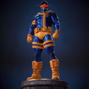 May include: A collectible figurine of a superhero character wearing a metallic blue and yellow tactical suit with a red visor over the eyes. The figure features a yellow belt with an X emblem, yellow gloves, and yellow boots, standing on a base.
