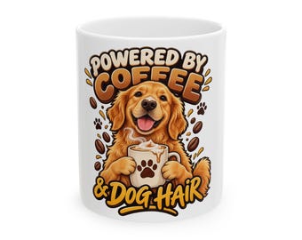 May include: A white ceramic mug featuring a graphic of a golden-colored dog holding a smaller mug. The text reads "POWERED BY COFFEE & DOG HAIR" in brown lettering, surrounded by scattered coffee beans and small paw print icons.