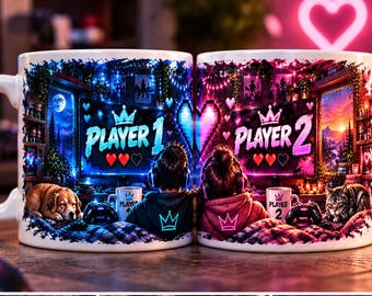 May include: Two white ceramic mugs featuring a gaming theme. The left mug displays 'PLAYER 1' with a crown, a dog, and blue lighting. The right mug shows 'PLAYER 2' with a crown, a cat, and pink lighting. Both mugs feature heart icons.