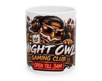 May include: A white ceramic mug featuring a graphic of an owl wearing sunglasses, a cap, and headphones. The owl holds a small cup. Text reads NIGHT OWL GAMING CLUB and OPEN TILL 3AM. The design includes coffee beans and crown icons.