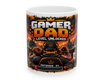 May include: A white ceramic mug featuring a colorful graphic of a person wearing headphones, sitting with two children. The text reads GAMER DAD LEVEL UNLOCKED and PATIENCE: 3% with a loading bar and heart icons against a fiery orange landscape.