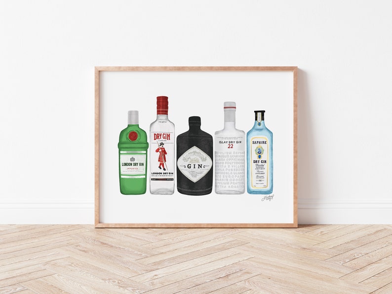 May include: A framed print featuring five different gin bottle illustrations. The bottles vary in color, including green, white, black, and blue, with labels that read "London Dry Gin" and "Sapphire Dry Gin". The artwork is displayed on a white background.