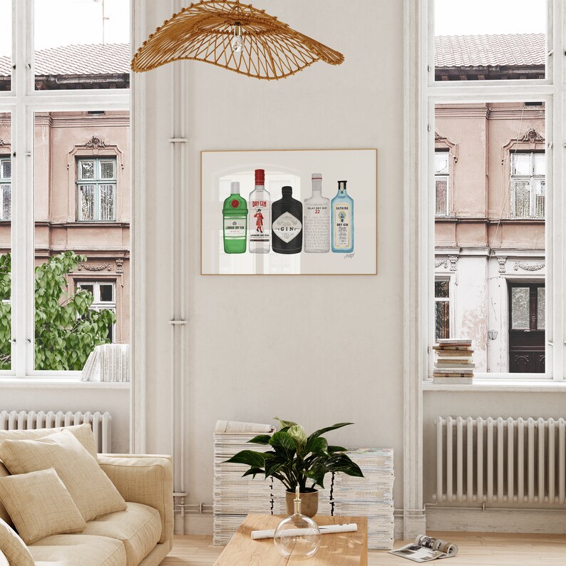 May include: A framed print featuring illustrations of five different gin bottles. The bottles are in various colors, including green, black, and blue, with distinct label designs. The artwork is displayed in a bright, airy room with a neutral color palette.