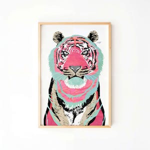 May include: A framed print of a colorful tiger with pink, blue, and black stripes. The tiger's eyes are black and the background is white.