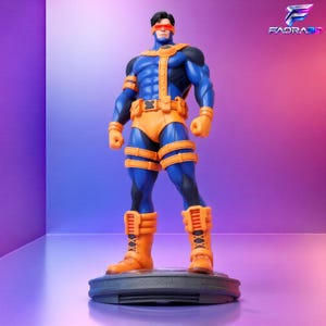May include: A collectible figurine of a superhero character wearing a blue and orange tactical suit with a red visor over the eyes. The figure stands on a circular base and features detailed muscle definition, utility straps, and boots.