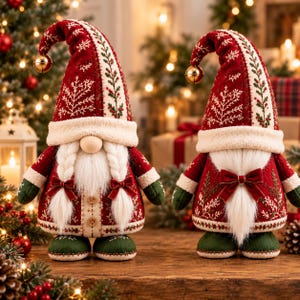 May include: Two plush gnome figurines wearing red pointed hats with white snowflake embroidery and gold jingle bells. The gnomes feature white faux fur beards, green mittens, and green boots. One gnome has braided hair and two buttons on its coat.
