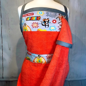 Superhero baby bathing apron. Gray and orange.