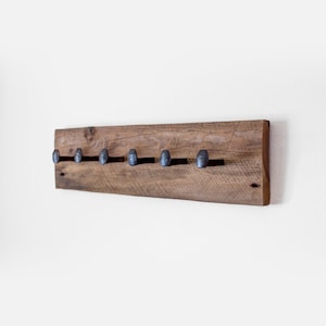 Rustic coat rack. Barn wood wall hanger. Railroad spike hooks. Reclaimed wood towel rack.