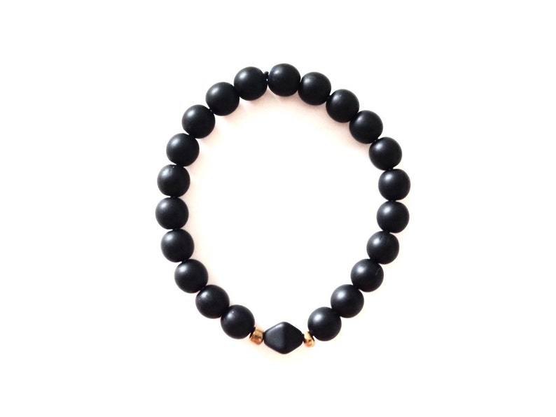 Large black glass bead bracelet with a 