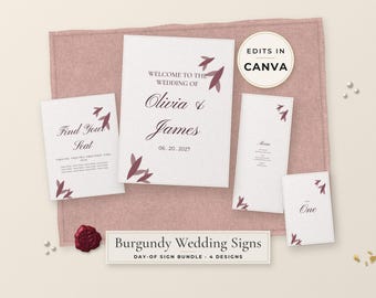 Op de afbeelding: Een set van vier witte trouwborden met bordeauxrode bladaccenten en zwarte tekst. De borden bevatten een welkomstbord voor Olivia en James, een tafelplan, een menu en een tafelnummer. Een bordeauxrode waszegel ligt erbij.