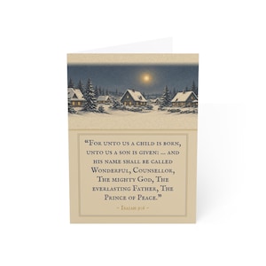 May include: A greeting card featuring a winter landscape with snow-covered houses and pine trees under a full moon. The lower section contains the text: For unto us a child is born, unto us a son is given: ... and his name shall be called Wonderful, Counsellor, The mighty God, The everlasting Father, The Prince of Peace. - Isaiah 9:6 -