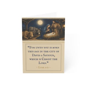 May include: A greeting card featuring a nativity scene with a full moon, a cow, a donkey, and figures surrounding a manger. Below the illustration, the text reads: For unto you is born this day in the city of David a Saviour, which is Christ the Lord. - Luke 2:11 -