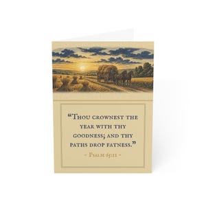 May include: A greeting card featuring a landscape illustration of a horse-drawn wagon in a wheat field at sunset. Below the image, the text reads: "THOU CROWNEST THE YEAR WITH THY GOODNESS; AND THY PATHS DROP FATNESS." - PSALM 65:11.