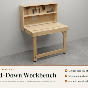 May include: A light-coloured wooden wall-mounted fold-down workbench with a pegboard back panel, a shelf, and folding legs. The text reads: DIY BUILD PLANS Fold-Down Workbench, Simple step-by-step, Shopping and cut lists, Instant download.