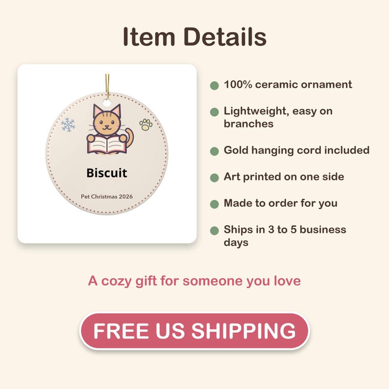 May include: A round ceramic ornament featuring a cartoon cat reading a book with the text Biscuit and Pet Christmas 2026. The ornament has a gold hanging cord and is decorated with a small snowflake and a paw print icon on a light background.