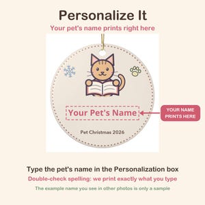 May include: A round ceramic Christmas ornament featuring a cartoon cat reading a book, a snowflake, and a paw print. The text reads Your Pet's Name and Pet Christmas 2026. The design includes a gold hanging string at the top center.