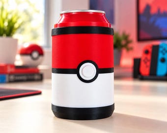 Könnte beinhalten: Ein zylindrischer Dosenkühler mit einer roten oberen und einer weißen unteren Hälfte, die durch ein schwarzes Querband mit einem mittigen, weißen, kreisförmigen Knopfdesign getrennt sind, das an einen rot-weißen Ball erinnert.
