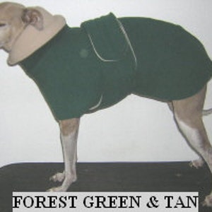May include: A forest green dog coat with a tan collar and a pocket on the back. The coat is made of fleece and is designed for cold weather.
