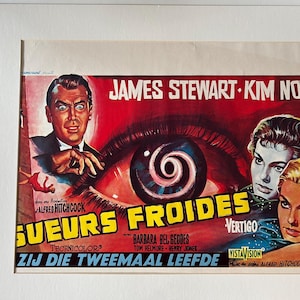 May include: A vintage movie poster for "Vertigo" starring James Stewart and Kim Novak. The poster has a red background with an eye and spiral design. The title is in French and Dutch.
