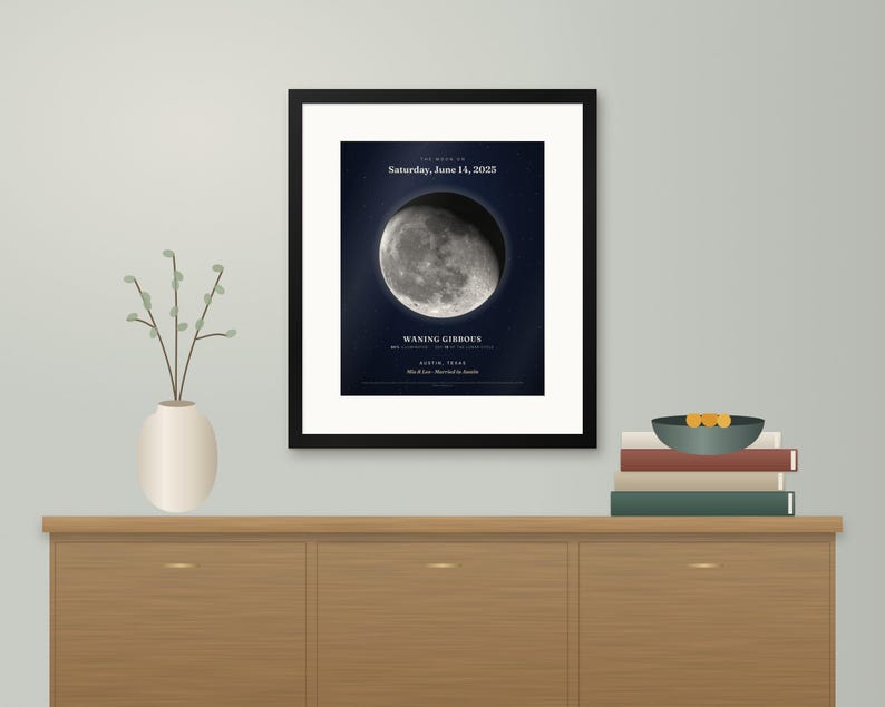 May include: A framed wall print featuring a detailed image of the moon in a waning gibbous phase. The text reads: The moon on Saturday, June 14, 2025, Waning Gibbous, Austin, Texas, Mia & Leo - Married in Austin.