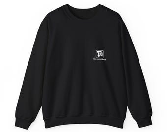 May include: A black long-sleeve crewneck sweatshirt featuring a small white square logo on the left chest. The logo contains the letters TN with a mountain graphic and the text TRUE NORTH ALPINE printed in white underneath the square.