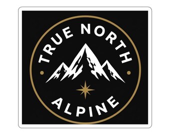May include: A square sticker featuring a black background with a circular gold border. Inside the circle, white text reads TRUE NORTH ALPINE, surrounding a white mountain graphic with a gold four-pointed star icon positioned below it.