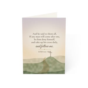 May include: A folded greeting card featuring a soft gradient background of pale yellow to white. The text reads: And he said to them all, If any man will come after me, let him deny himself, and take up his cross daily, and follow me. LUKE 9:23 - KJV. Below is a cross on a hill.