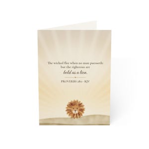 May include: A greeting card with a light beige background featuring a sunburst effect. The text reads: The wicked flee when no man pursueth: but the righteous are bold as a lion. PROVERBS 28:1 - KJV. A small illustration of a lion is below.