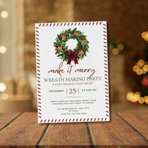 May include: A white invitation card with a red dashed border featuring a green wreath with orange slices and a red bow. Text reads: make it merry WREATH MAKING PARTY A COZY HOLIDAY CRAFT NIGHT DECEMBER 25 AT 6:00 PM CRAFT SUPPLIES PROVIDED.