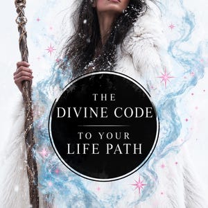 May include: A person in a white fur-trimmed hooded cloak holds a tall staff topped with a crescent moon. A black circular emblem in the center displays the white text: THE DIVINE CODE TO YOUR LIFE PATH, surrounded by blue swirling mist and pink stars.