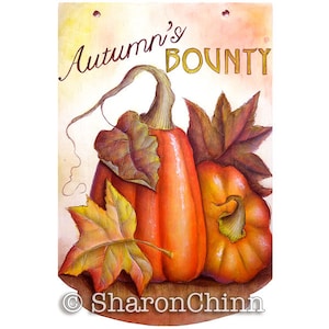 May include: A wooden sign featuring a watercolor painting of two pumpkins and fall leaves. The sign reads "Autumn's Bounty" in gold lettering. The pumpkins are orange and the leaves are shades of brown and yellow.