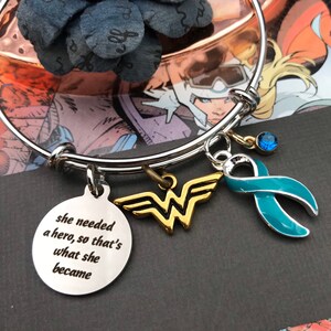 She Needed a Hero So That's What She Became - Teal Ribbon Charm Bracelet