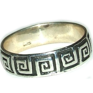 May include: A silver band ring with a black Greek key design.