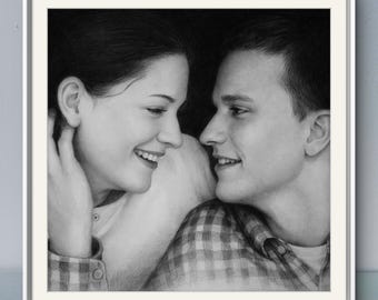 May include: A black and white graphite drawing of two people facing each other. The person on the left has dark hair and is smiling, while the person on the right has short hair and wears a plaid shirt. Both are captured in a close-up portrait.