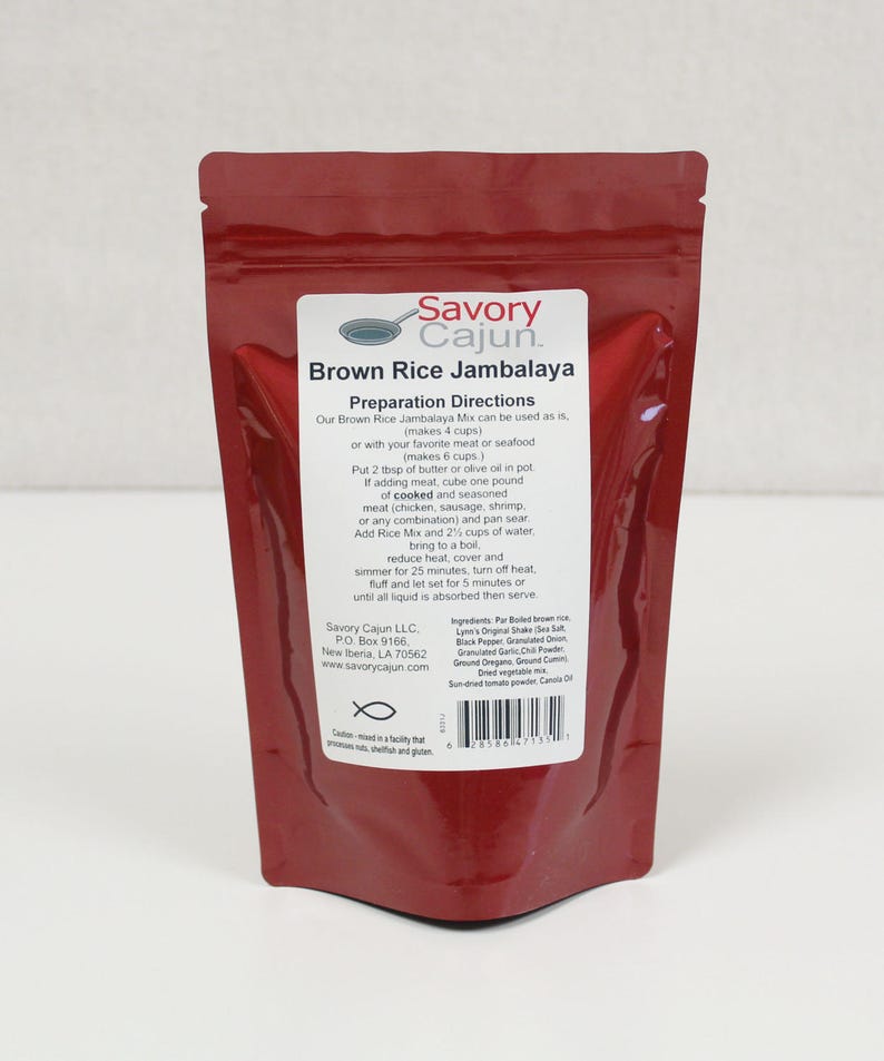 May include: A brown pouch of Savory Cajun Brown Rice Jambalaya mix. The label includes preparation directions and ingredient information. The pouch is sealed and ready for use. The product makes 4 cups as is, or 6 cups with meat or seafood.