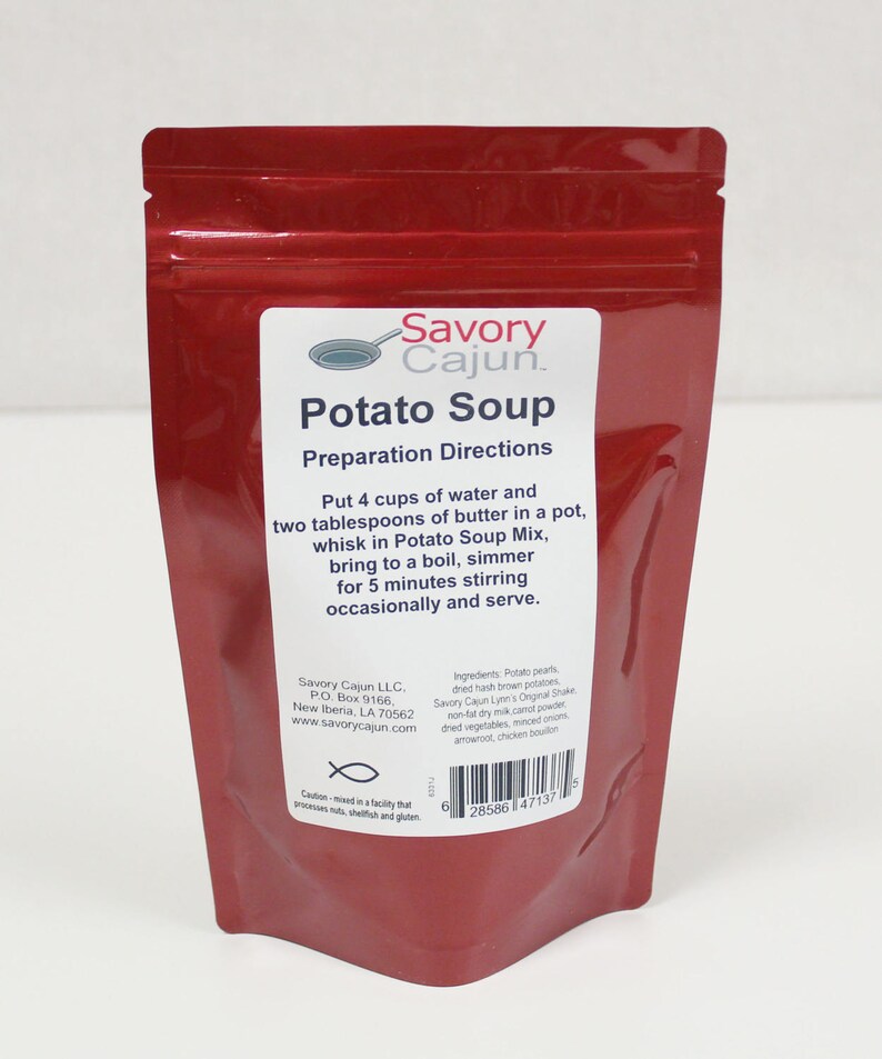 May include: A red pouch of Savory Cajun Potato Soup mix. The label includes preparation directions: add water and butter, bring to a boil, and simmer. The package also lists ingredients and contact information.