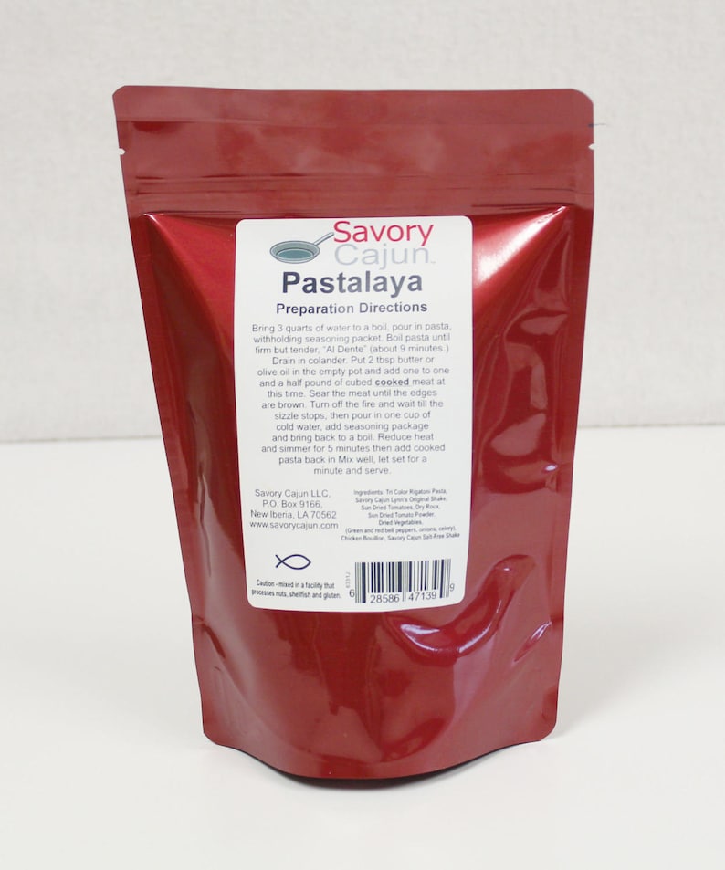 May include: Red resealable pouch with a white label that reads "Savory Cajun. Pastalaya Preparation Directions". The label includes instructions for preparing a Pastalaya dish, a list of ingredients, and a fish symbol.