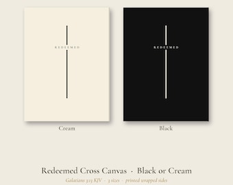Op de afbeelding: Twee rechthoekige doeken, één crème met een zwart kruis en één zwart met een wit kruis. Beide tonen het woord REDEEMED in het midden van het kruis. De tekst luidt: Redeemed Cross Canvas, Black or Cream, Galatians 3:13 KJV.