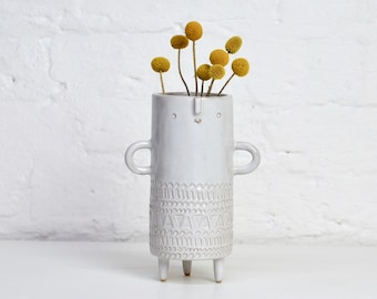 Tall slim ceramic tripod plant pot vase with face and arms //  white stamped texture